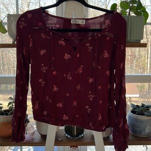 Hollister red/maroon floral blouse with a least V-neck